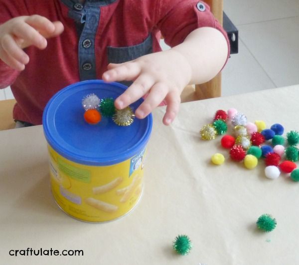 Pom Pom Drop for fine motor practice for toddlers