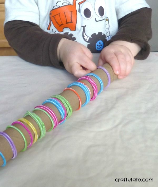 Cardboard Tube and Elastic Hair Bands - fine motor skills practice