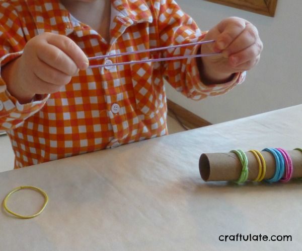 Cardboard Tube and Elastic Hair Bands - fine motor skills practice