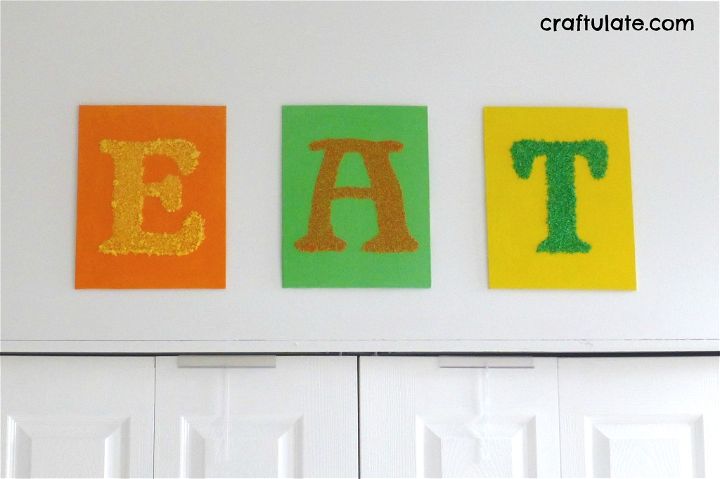 Kitchen Wall Art that kids can help make! Uses dyed salt, couscous and rice on canvas panels.