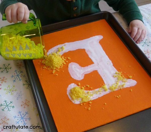 Kitchen Wall Art that kids can help make! Uses dyed salt, couscous and rice on canvas panels.