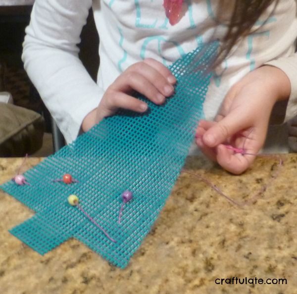 Fine Motor Christmas Tree Sewing Activity from Craftulate