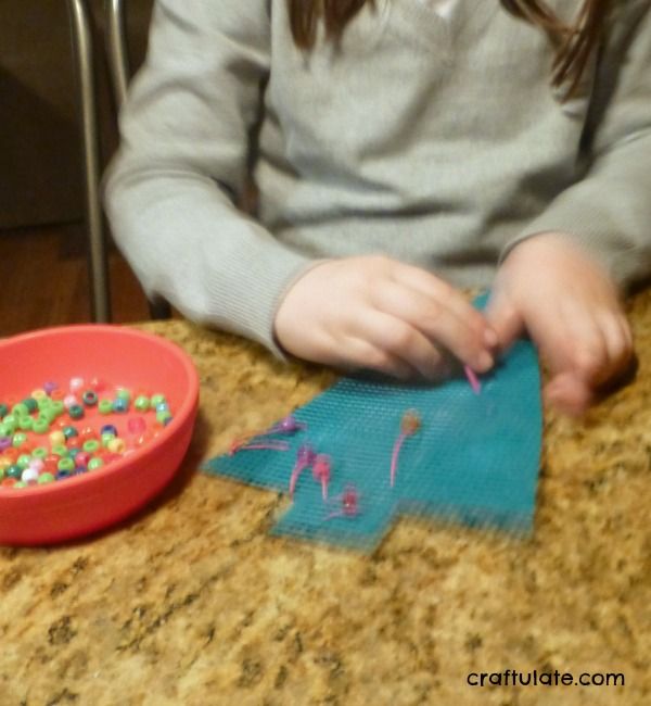 Fine Motor Christmas Tree Sewing Activity from Craftulate