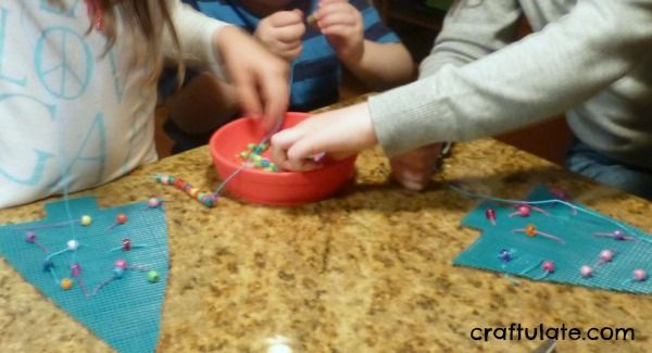 Fine Motor Christmas Tree Sewing Activity from Craftulate