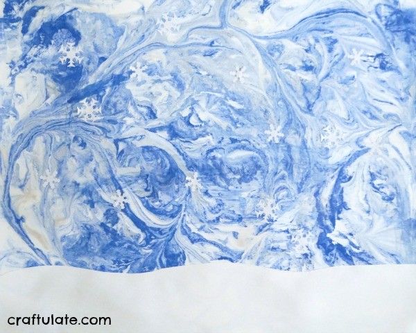 Winter Sky Art for Kids - using a marbling technique and paper punches!