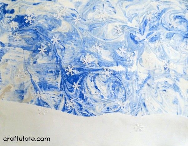 Winter Sky Art for Kids - using a marbling technique and paper punches!