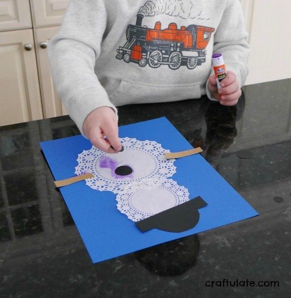 Doily Snowmen Craft - a fun winter activity for kids