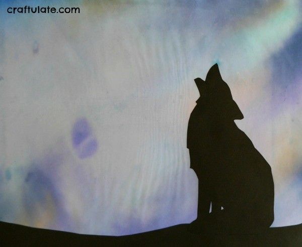 Wolf Art for Kids - silhouette wolf with a background made from markers and water!