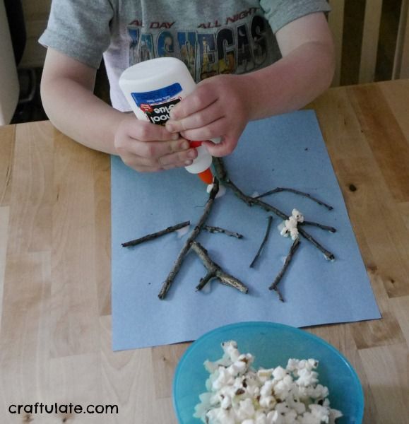 Popcorn Trees - a fun kids craft to make with sticks and leftover popcorn!