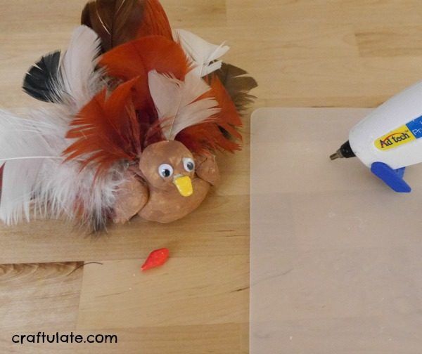 Clay Turkey Craft for Kids - use air dry clay, feathers and paint to make this cute turkey!