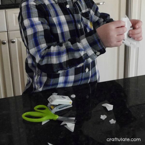 Paper Punch Snowflakes - a winter craft for kids to make