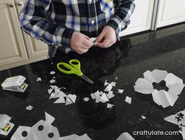 Paper Punch Snowflakes - a winter craft for kids to make