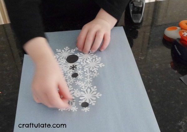 Paper Punch Snowman - a winter craft for kids